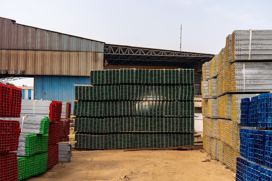 Colorful stacks of industrial materials organized in an outdoor yard, showcasing vibrant organization.